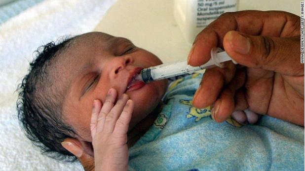 A girl, 1 hour old, receives an anti-retroviral drug in South Africa to prevent infection from the HIV virus carried by her mother (CNN photo)