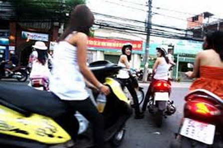 Sex workers wait for customers on a street in downtown Ho Chi Minh City. Photo: Pham Le